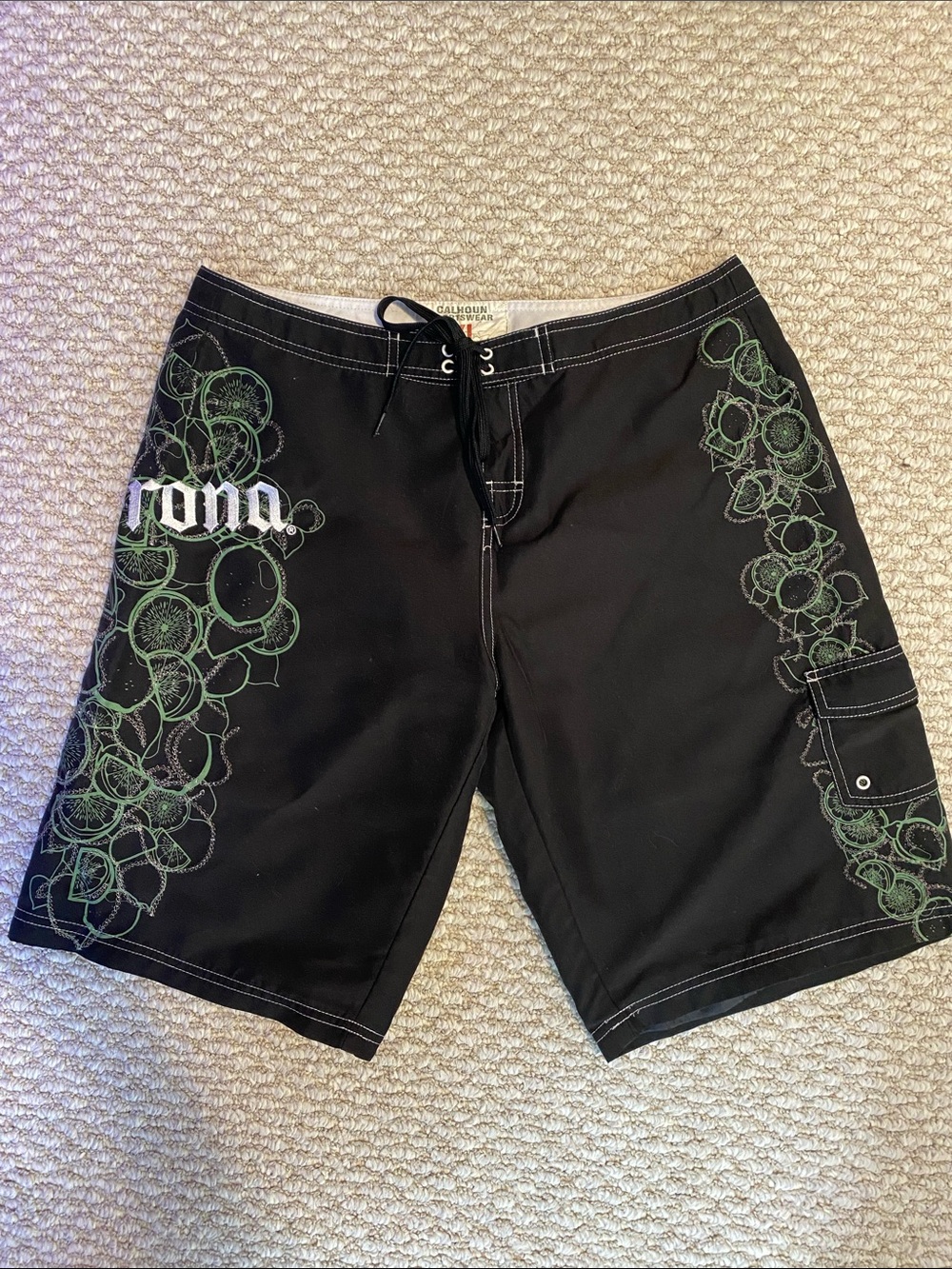 Corona Embroidered Black Board Shorts with Green Accents